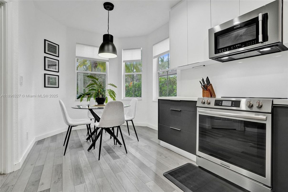 Dining room, Interior, Kitchen, Pendant Lights, Stainless Steel Appliances, Wood Texture Flooring