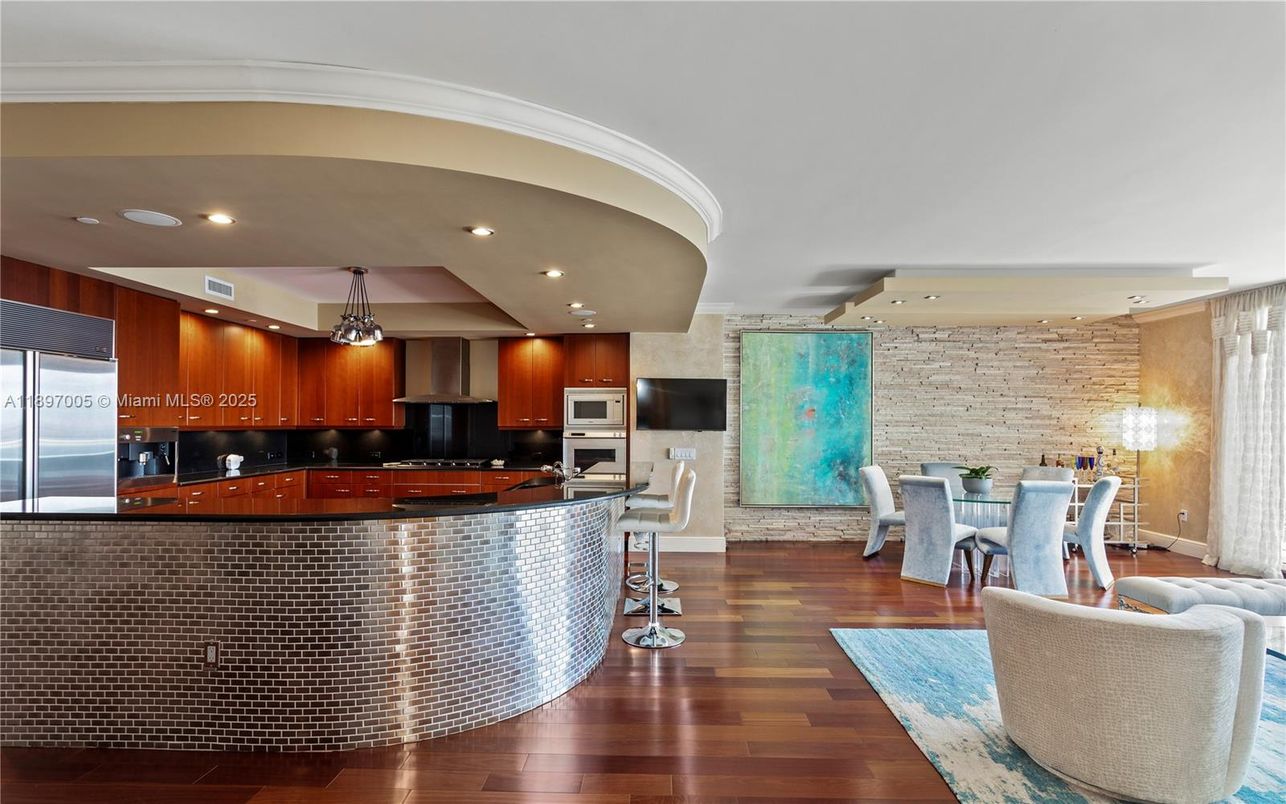 Dining room, Interior, Kitchen, Pendant Lights, Recessed Lighting, Stainless Steel Appliances, Stone Walls, Wood Texture Flooring