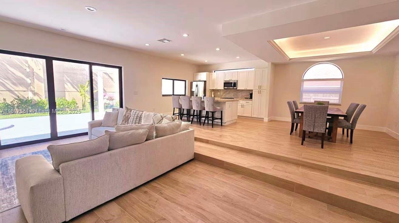 Dining room, Interior, Kitchen, Living room, Recessed Lighting, Stainless Steel Appliances, Wood Texture Flooring