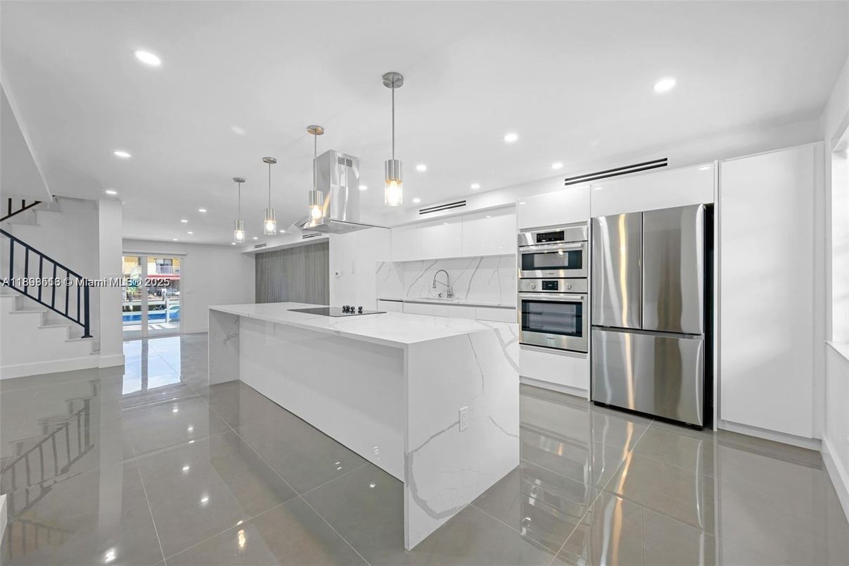 Interior, Kitchen, Marble Walls, Pendant Lights, Recessed Lighting, Stainless Steel Appliances