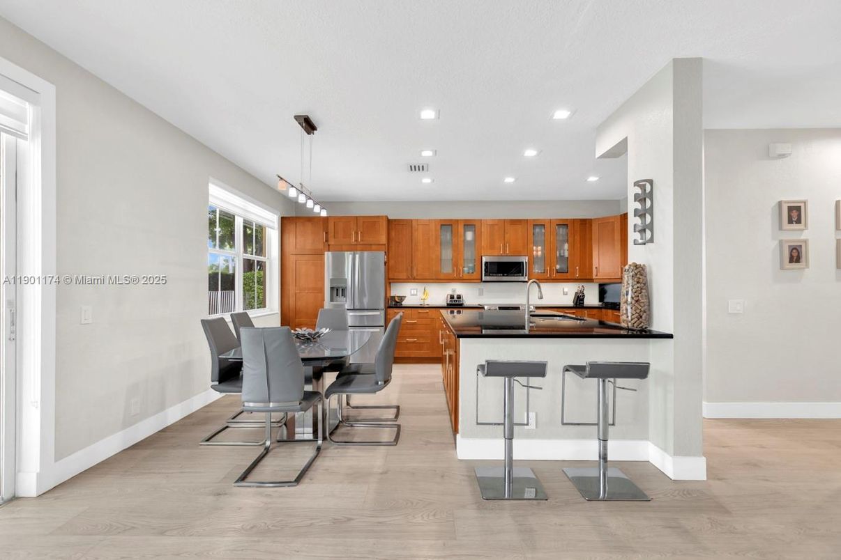 Dining room, Interior, Kitchen, Pendant Lights, Recessed Lighting, Stainless Steel Appliances, Wood Texture Flooring