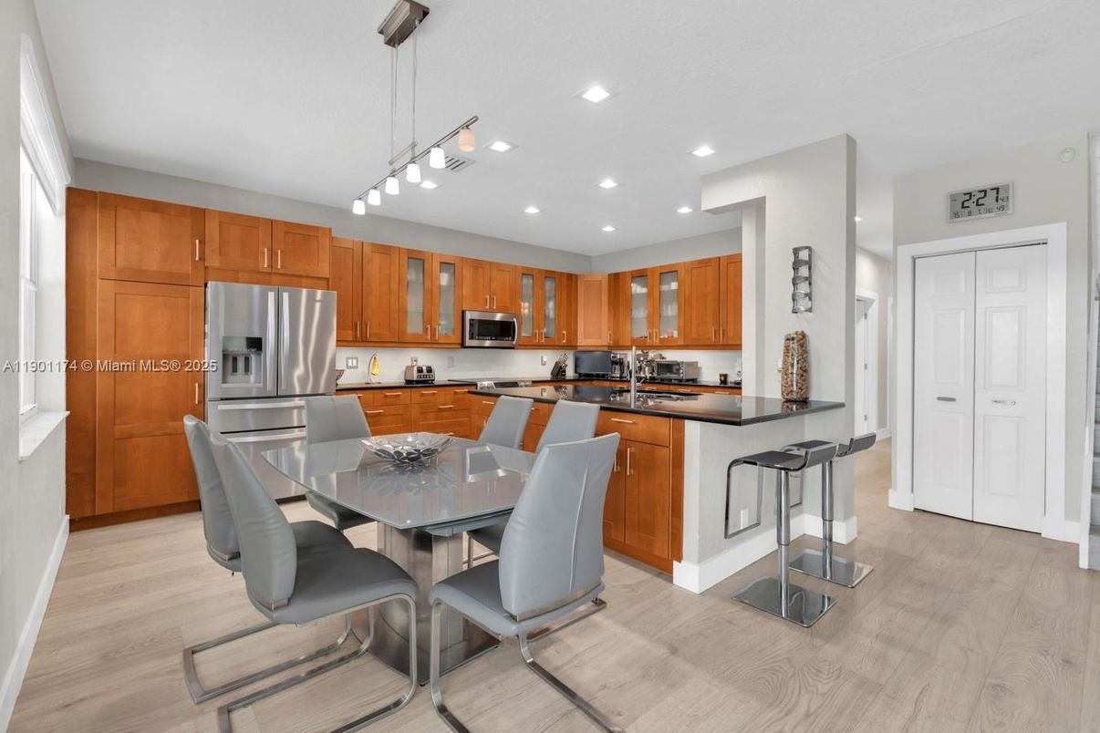 Dining room, Interior, Kitchen, Pendant Lights, Recessed Lighting, Stainless Steel Appliances, Wood Texture Flooring