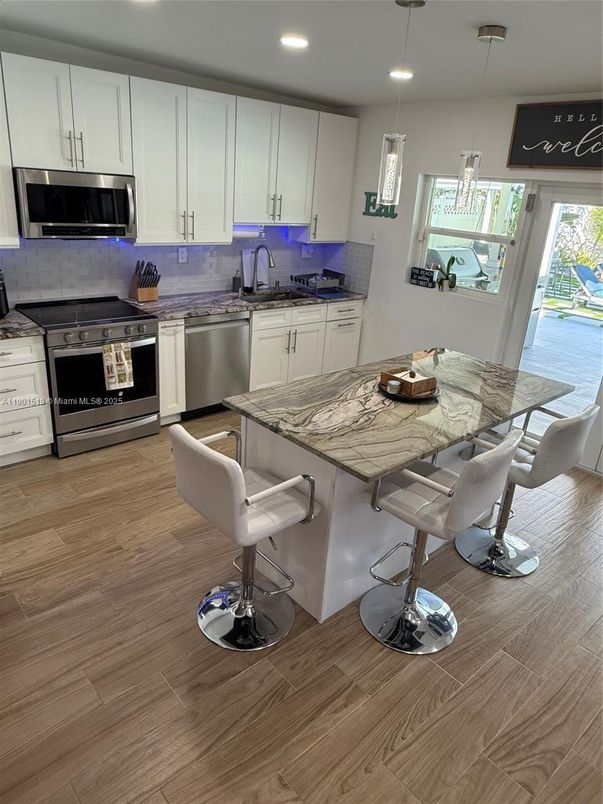 Interior, Kitchen, Pendant Lights, Recessed Lighting, Stainless Steel Appliances, Wood Texture Flooring