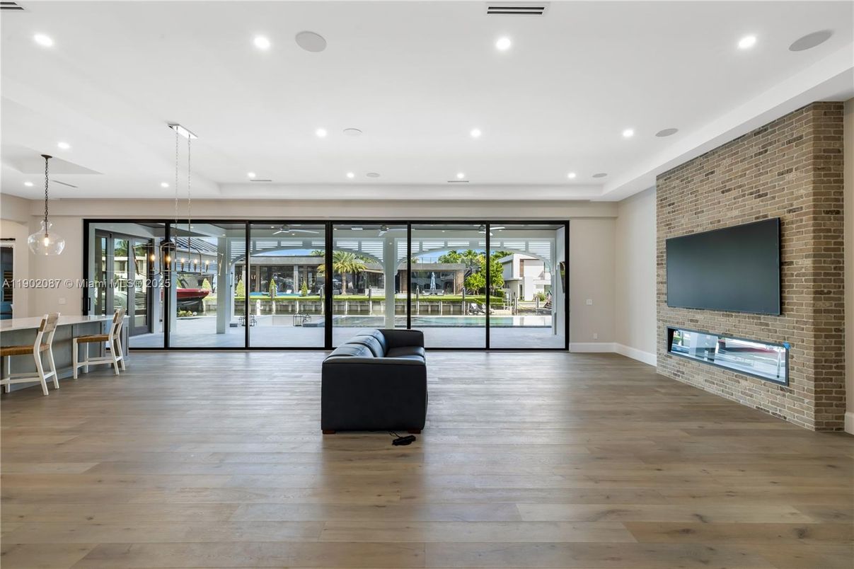 Fireplace, Interior, Pendant Lights, Recessed Lighting, Stone Walls, Wood Texture Flooring