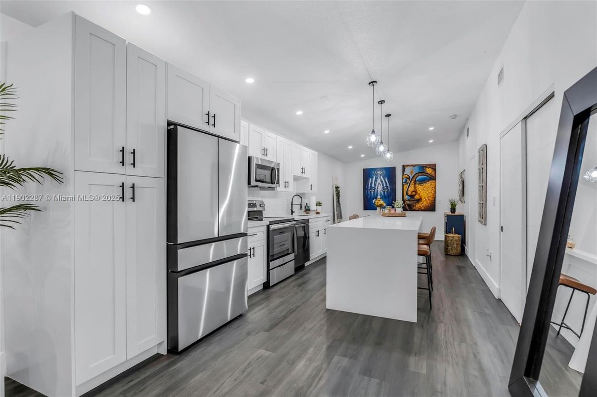 Dining room, Interior, Kitchen, Pendant Lights, Recessed Lighting, Stainless Steel Appliances, Wood Texture Flooring