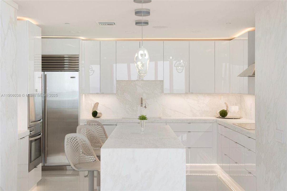 Interior, Kitchen, Marble Walls, Pendant Lights, Recessed Lighting, Stainless Steel Appliances