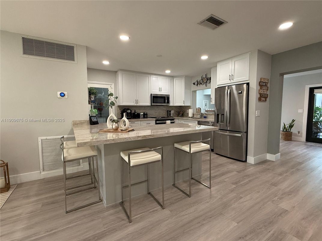 Interior, Kitchen, Recessed Lighting, Stainless Steel Appliances, Wood Texture Flooring