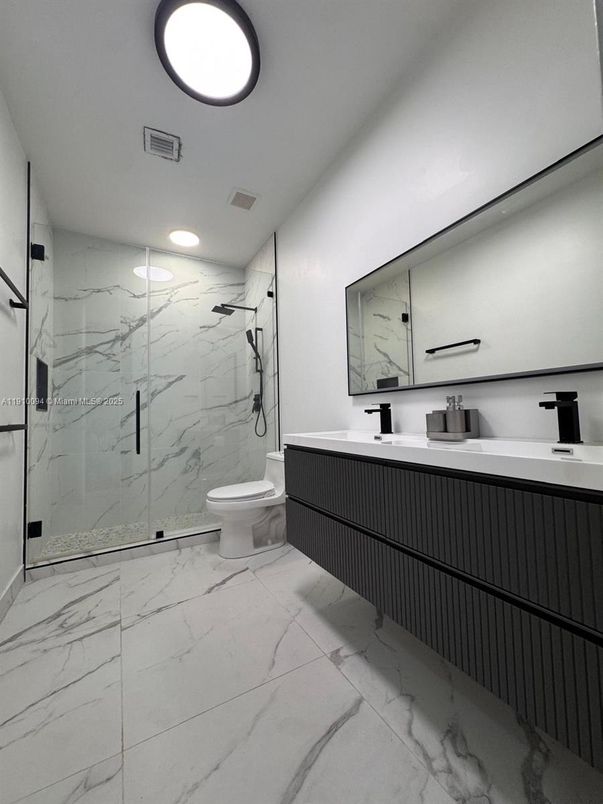 Bathroom, Dual Sink Vanities, Glass Shower, Interior, Marble, Marble Walls, Recessed Lighting