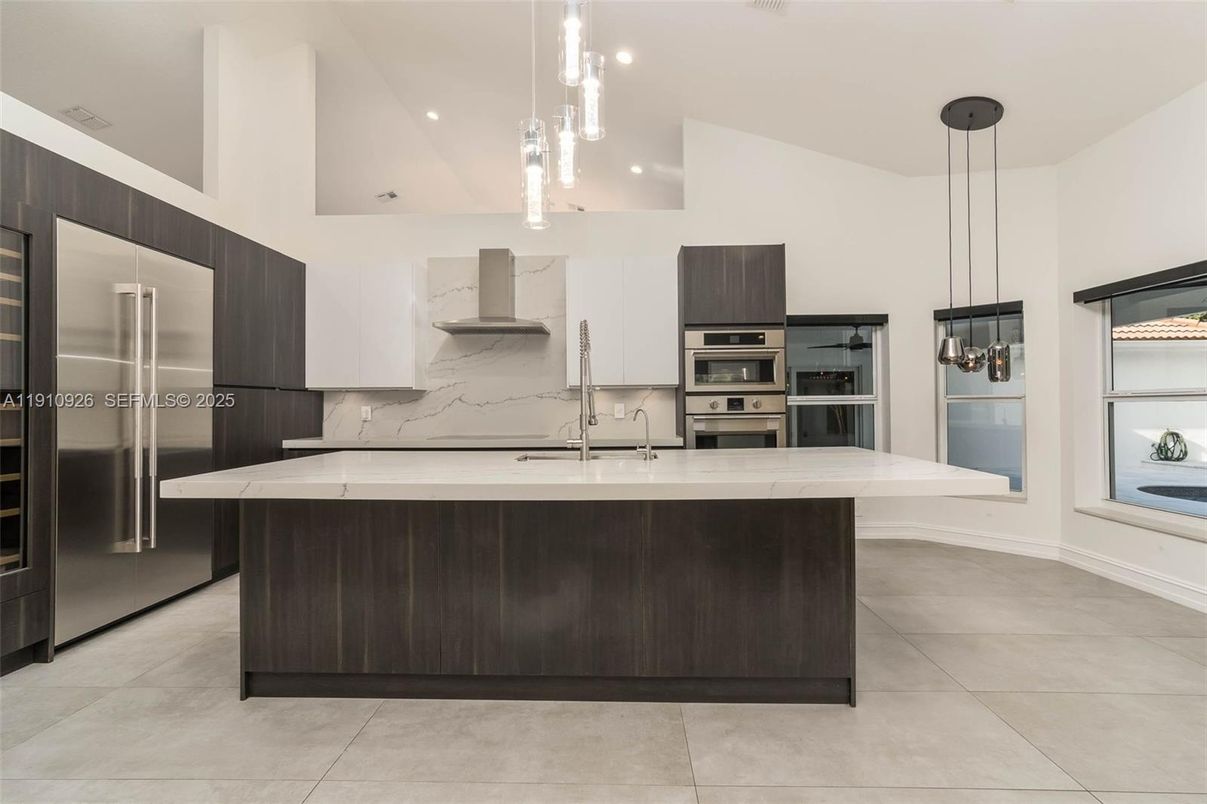 Interior, Kitchen, Marble Walls, Pendant Lights, Recessed Lighting, Stainless Steel Appliances