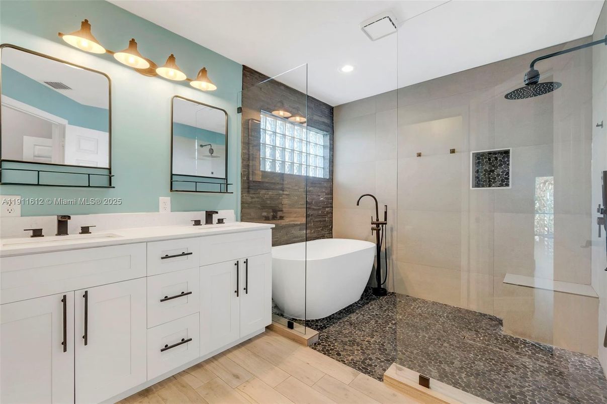 Bathroom, Dual Sink Vanities, Free Standing Baths, Glass Shower, Interior, Recessed Lighting, Wood Texture Flooring