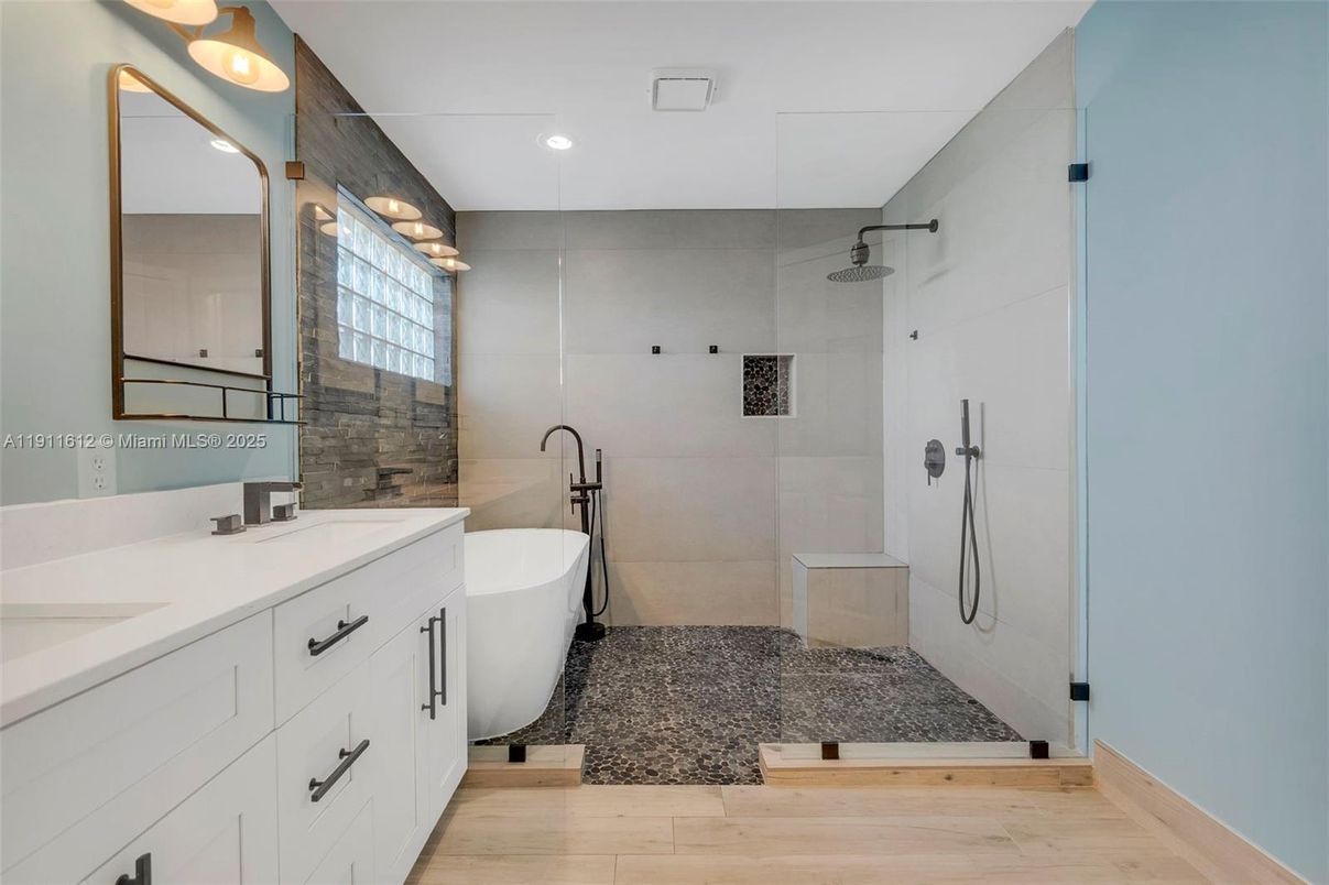 Bathroom, Dual Sink Vanities, Free Standing Baths, Glass Shower, Interior, Recessed Lighting, Wood Texture Flooring