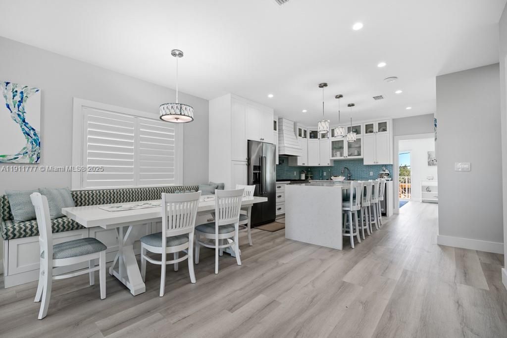Dining room, Interior, Kitchen, Pendant Lights, Recessed Lighting, Stainless Steel Appliances, Wood Texture Flooring