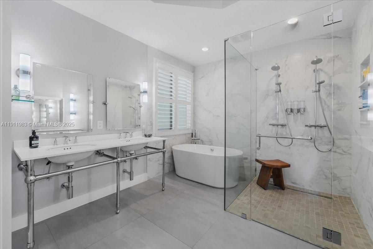 Bathroom, Dual Sink Vanities, Free Standing Baths, Glass Shower, Interior, Marble Walls, Recessed Lighting