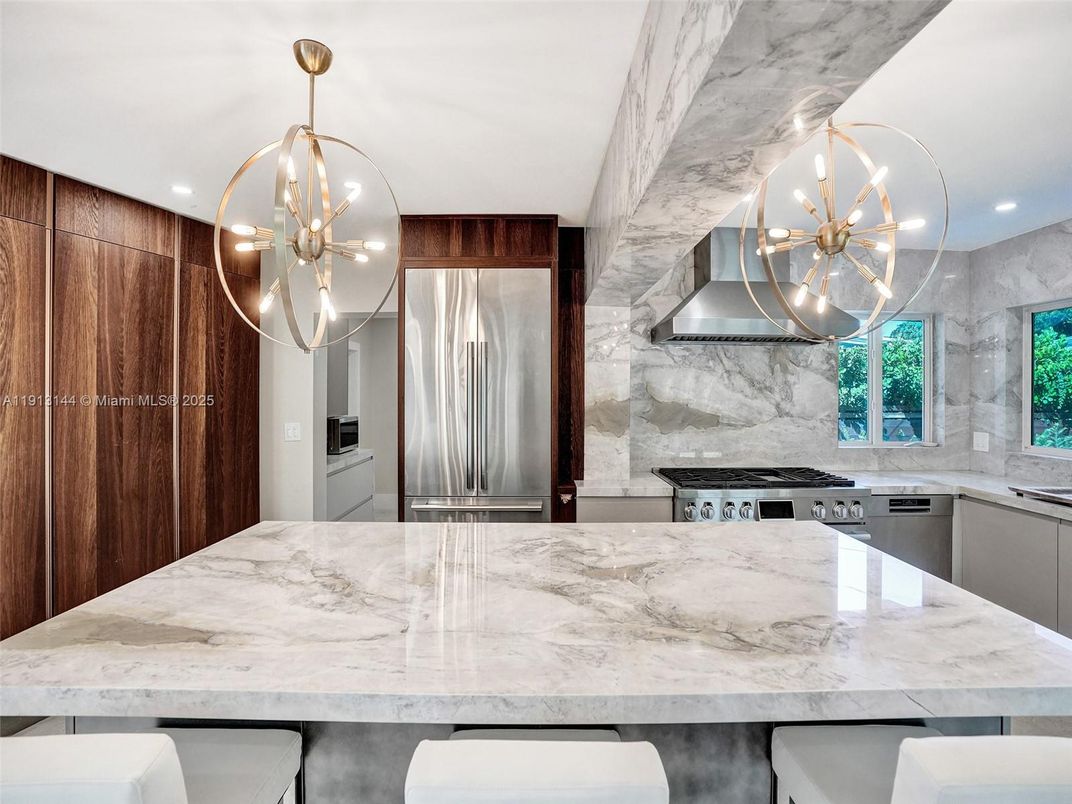 Interior, Kitchen, Marble Walls, Pendant Lights, Recessed Lighting, Stainless Steel Appliances