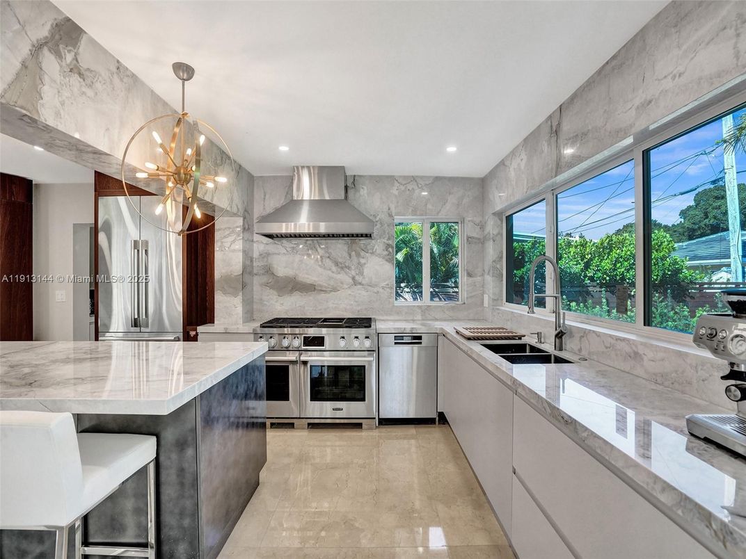 Interior, Kitchen, Marble Walls, Pendant Lights, Recessed Lighting, Stainless Steel Appliances
