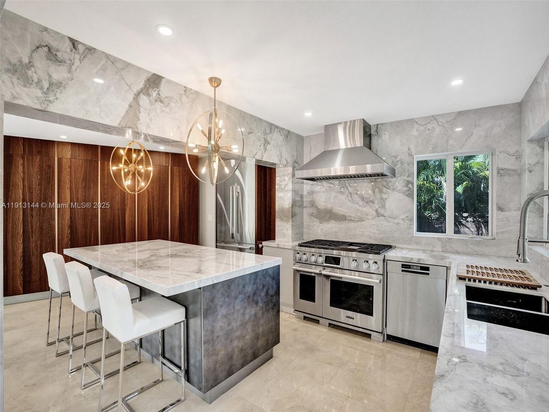 Interior, Kitchen, Marble Walls, Pendant Lights, Recessed Lighting, Stainless Steel Appliances
