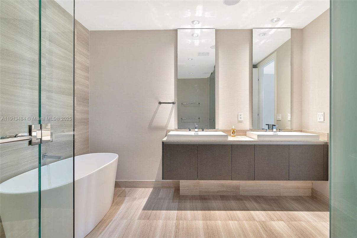 Bathroom, Dual Sink Vanities, Free Standing Baths, Glass Shower, Interior, Recessed Lighting, Wood Texture Flooring