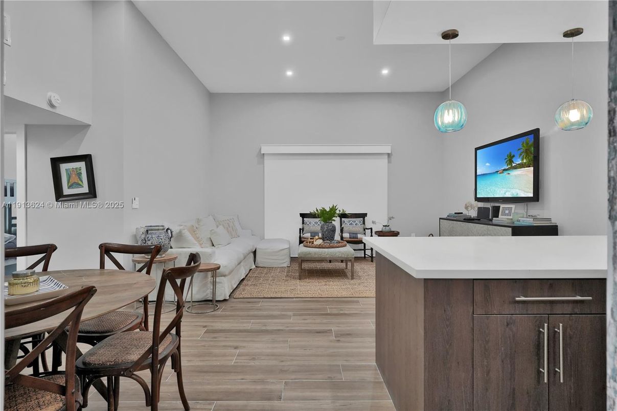 Dining room, Fireplace, Interior, Living room, Pendant Lights, Recessed Lighting, Wood Texture Flooring
