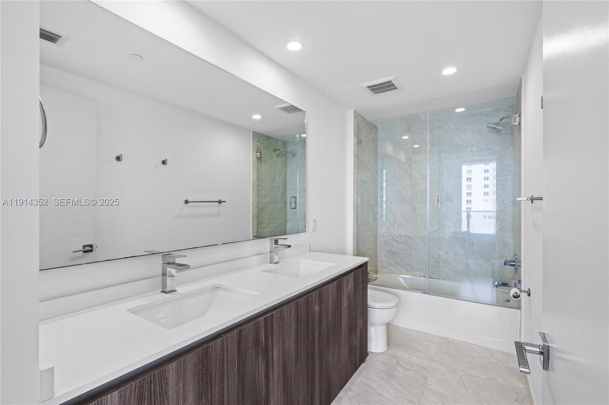 Bathroom, Dual Sink Vanities, Glass Shower, Interior, Marble Walls, Recessed Lighting