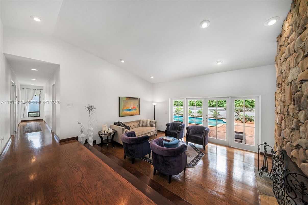 Fireplace, Interior, Living room, Recessed Lighting, Stone Walls, Water, Wood Texture Flooring