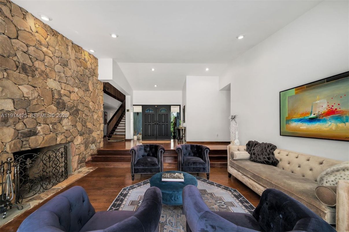 Fireplace, Interior, Living room, Recessed Lighting, Stone Walls, Wood Texture Flooring