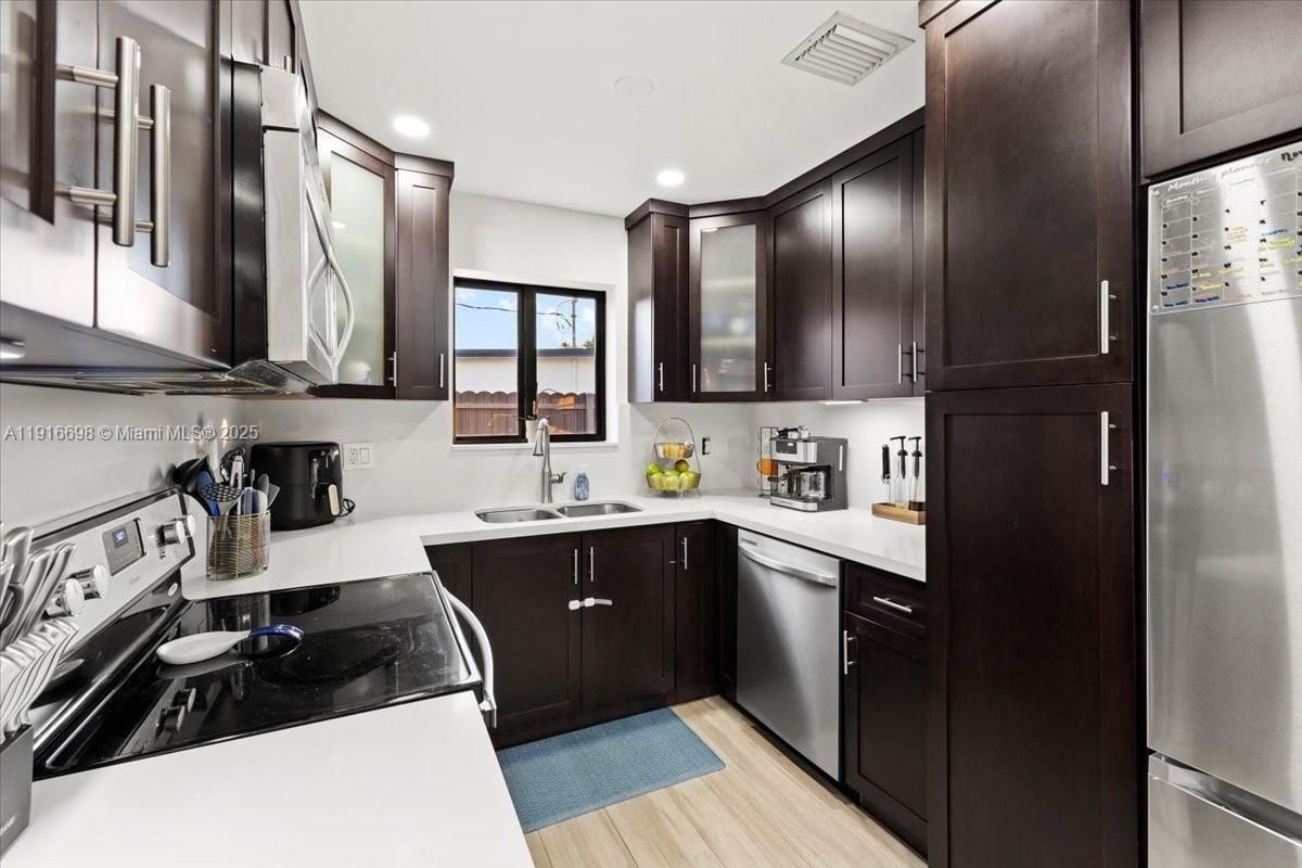 Interior, Kitchen, Recessed Lighting, Stainless Steel Appliances, Wood Texture Flooring