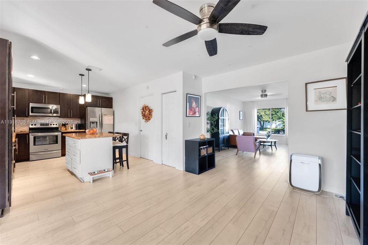 Dining room, Interior, Kitchen, Pendant Lights, Recessed Lighting, Stainless Steel Appliances, Wood Texture Flooring
