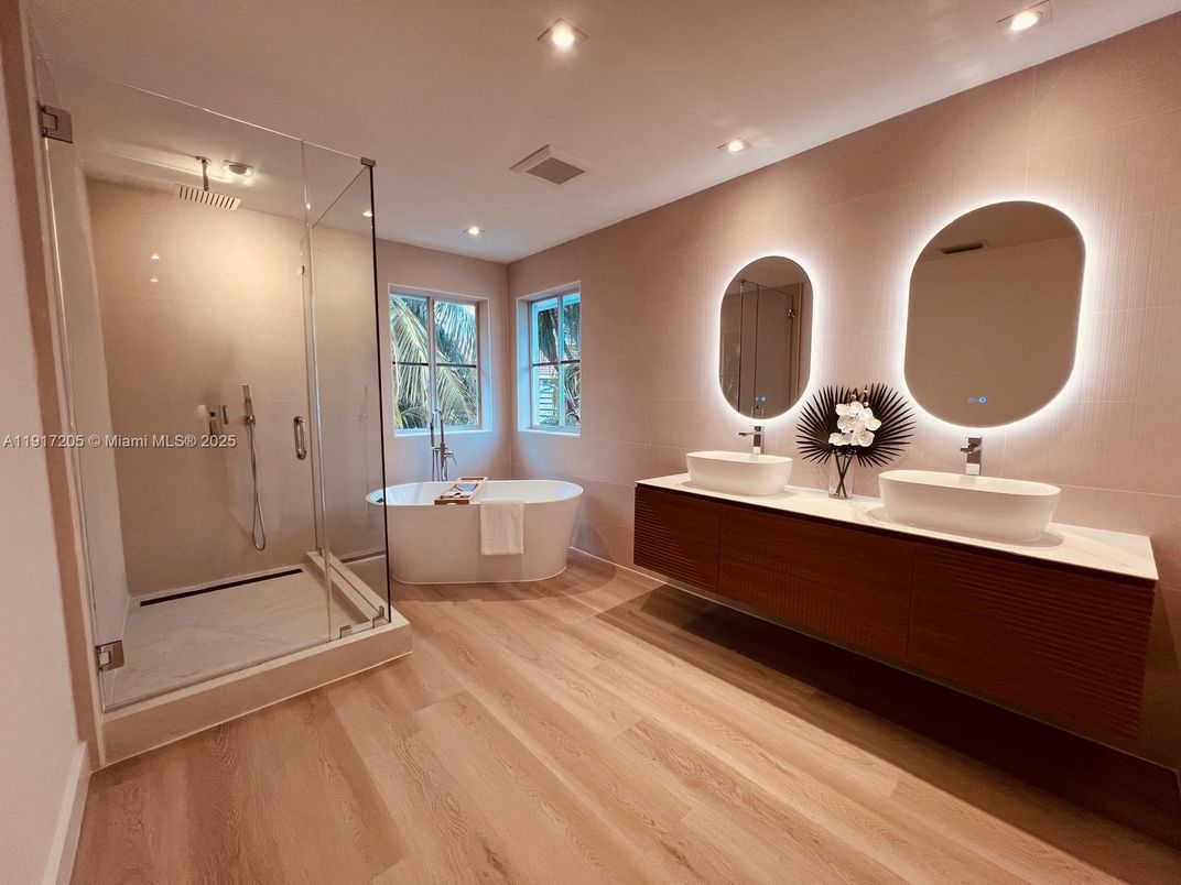 Bathroom, Dual Sink Vanities, Free Standing Baths, Glass Shower, Interior, Recessed Lighting, Wood Texture Flooring