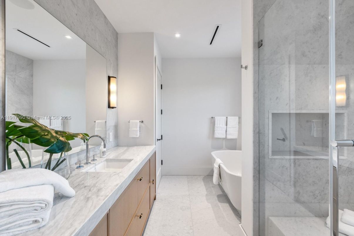 Bathroom, Dual Sink Vanities, Free Standing Baths, Glass Shower, Interior, Marble Walls, Recessed Lighting