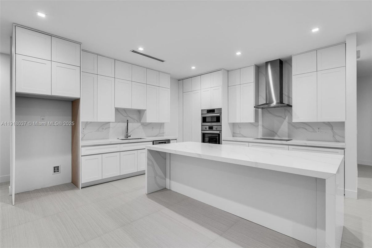 Interior, Kitchen, Marble Walls, Recessed Lighting, Stainless Steel Appliances