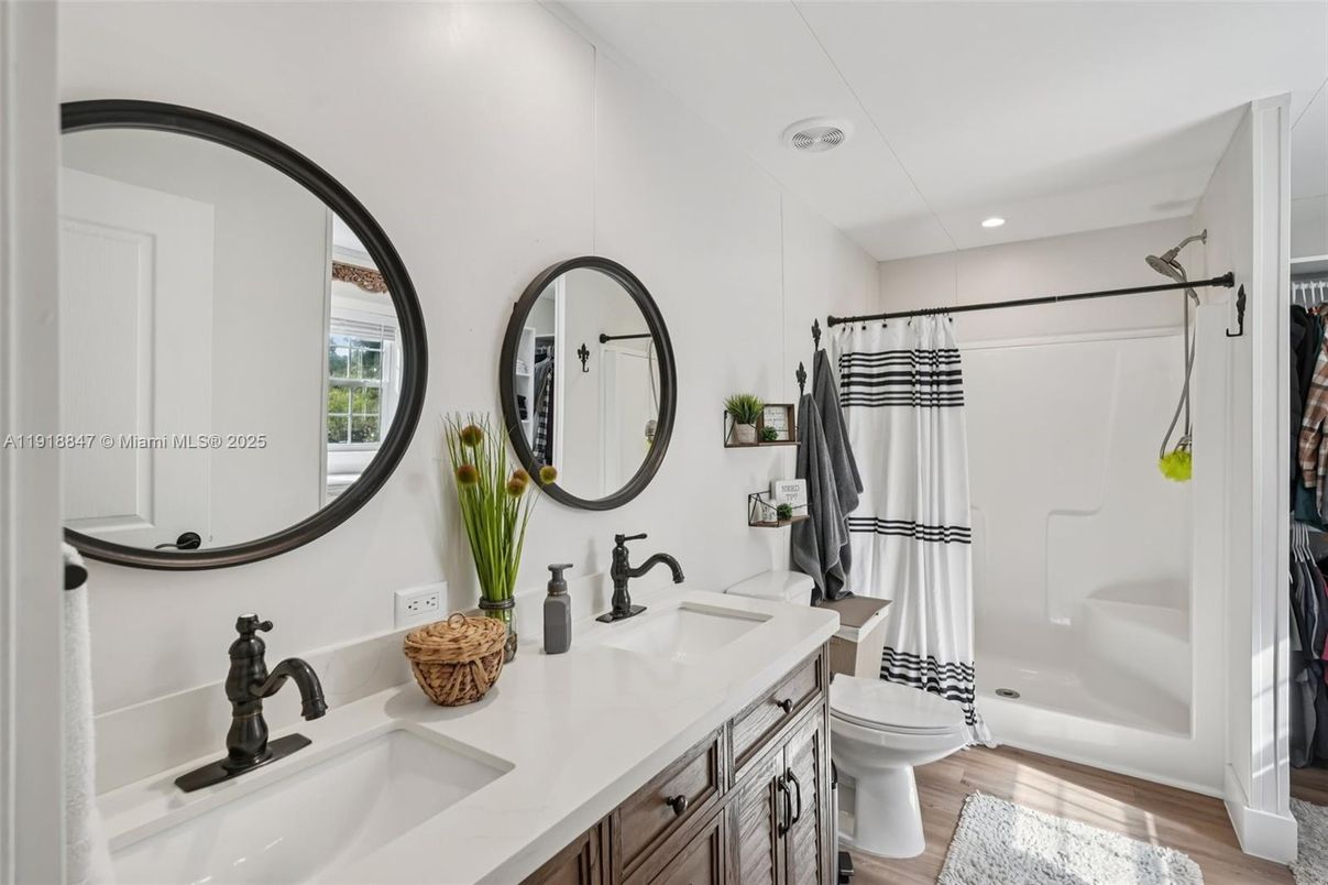 Bathroom, Dual Sink Vanities, Interior, Recessed Lighting, Wood Texture Flooring