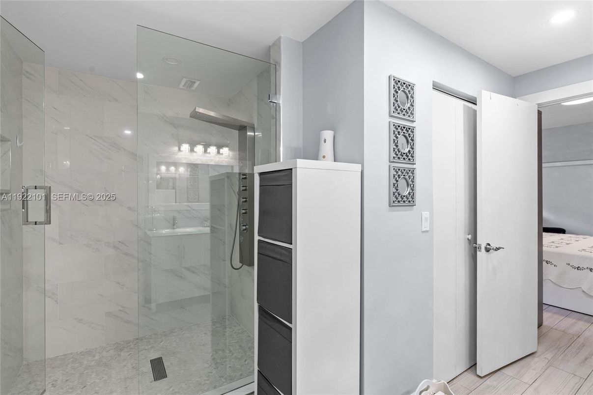 Bathroom, Glass Shower, Interior, Marble Walls, Recessed Lighting, Wood Texture Flooring