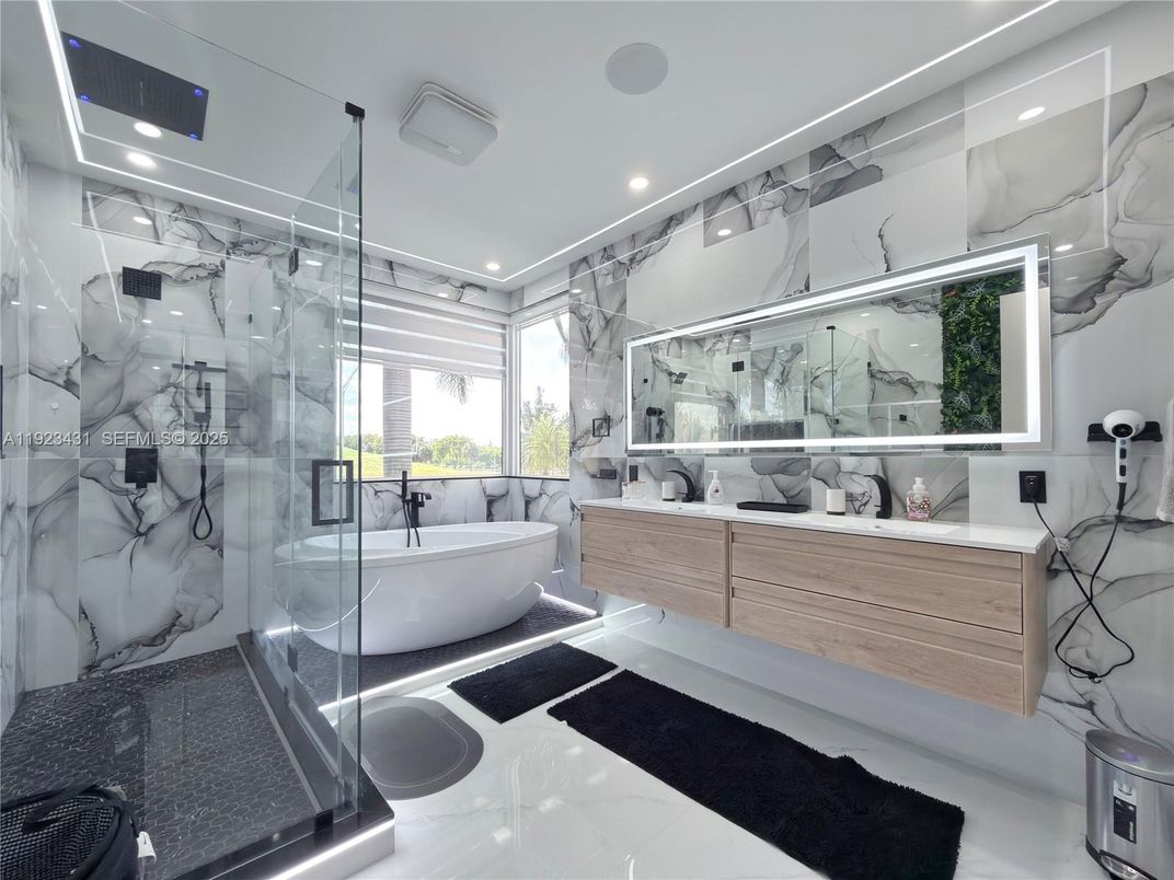 Bathroom, Dual Sink Vanities, Free Standing Baths, Glass Shower, Interior, Marble Walls, Recessed Lighting