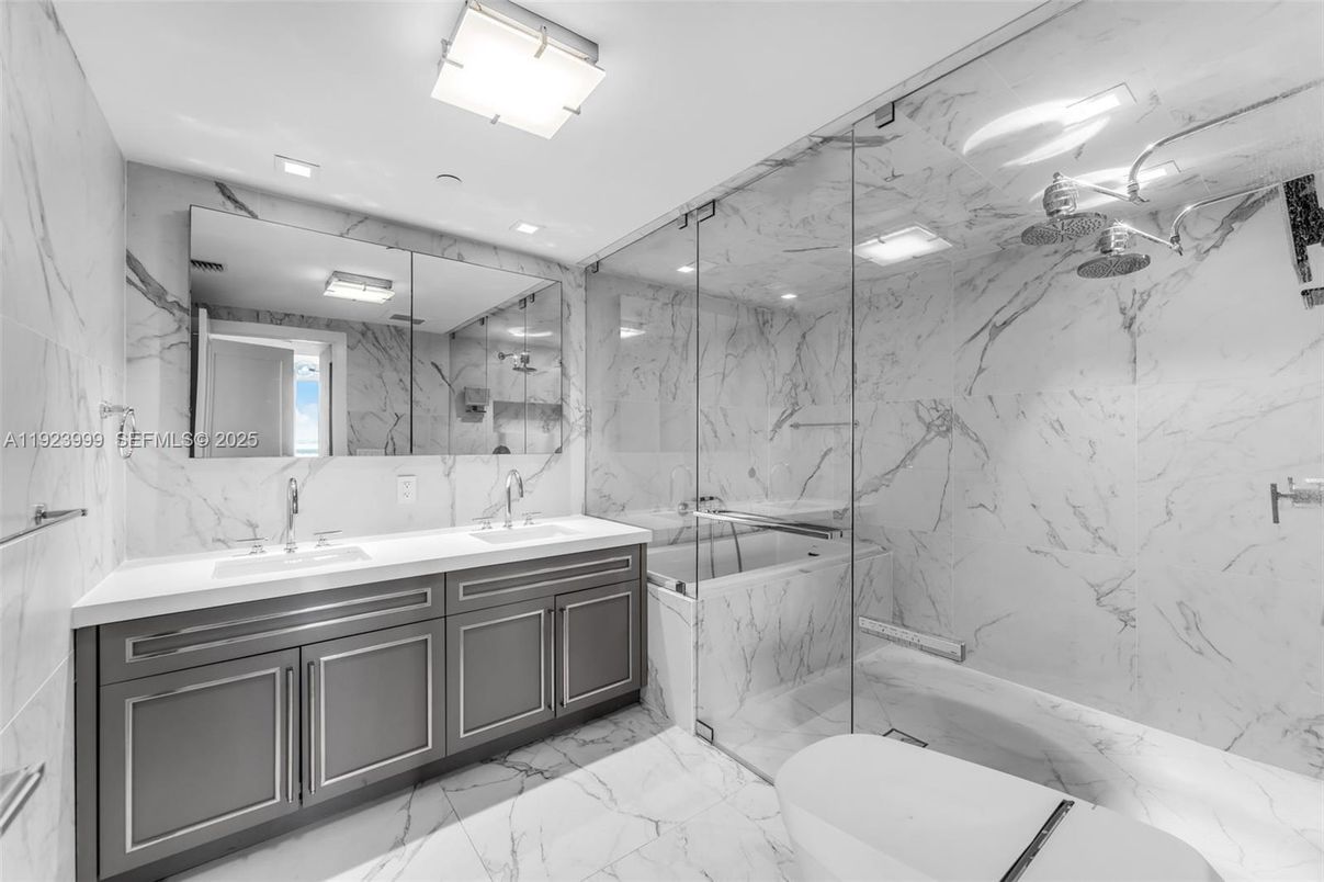 Bathroom, Dual Sink Vanities, Glass Shower, Interior, Marble, Marble Walls, Recessed Lighting