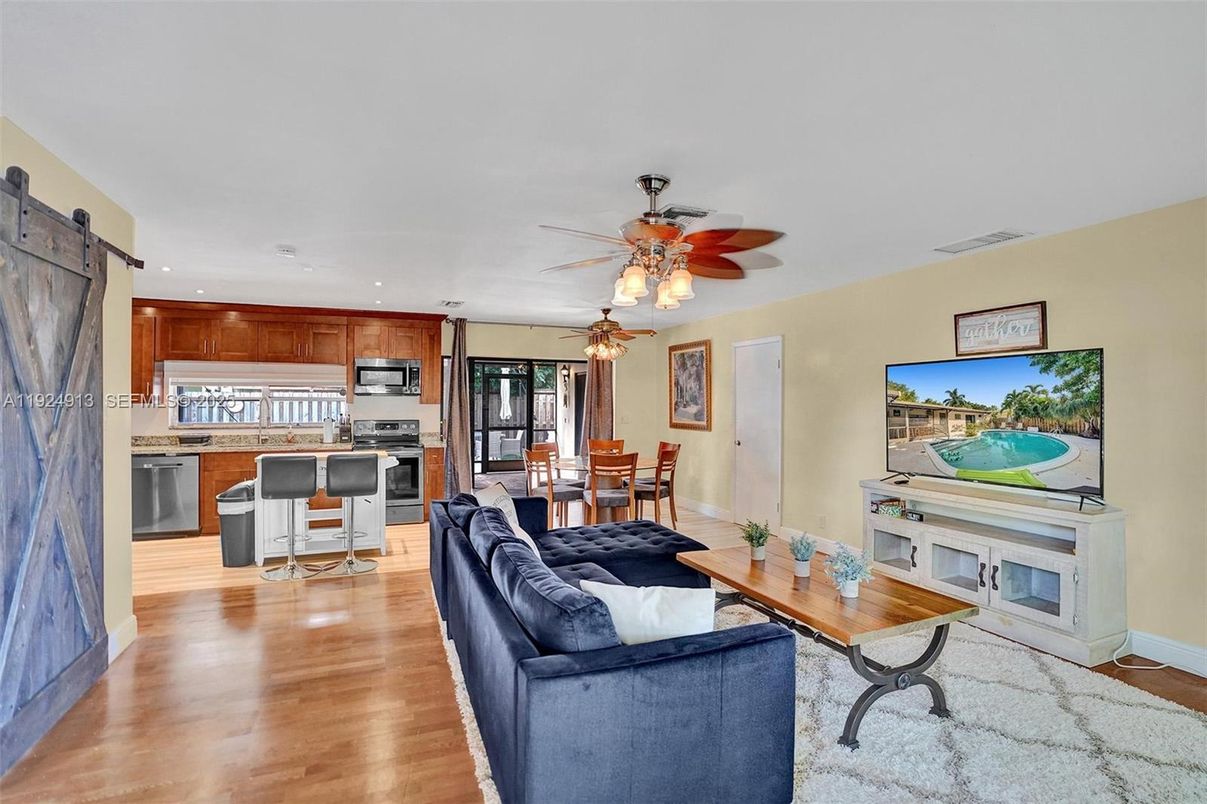 Dining room, Interior, Kitchen, Living room, Recessed Lighting, Stainless Steel Appliances, Wood Texture Flooring