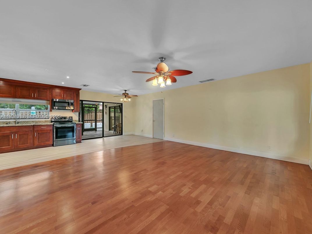 Empty room, Interior, Kitchen, Stainless Steel Appliances, Wood Texture Flooring