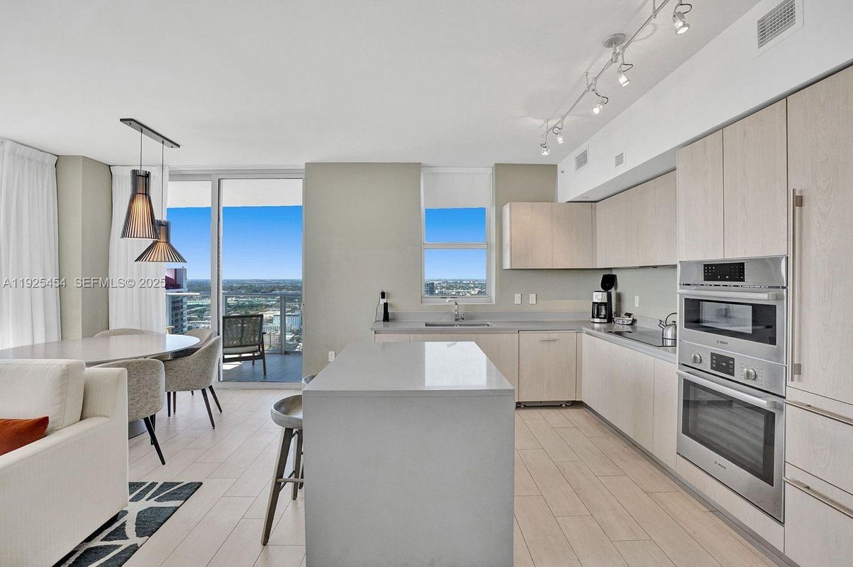 Dining room, Interior, Kitchen, Pendant Lights, Stainless Steel Appliances, Water, Wood Texture Flooring