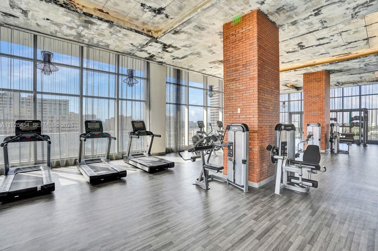 Fitness Equipment, Gym, Interior, Stone Walls, Wood Texture Flooring