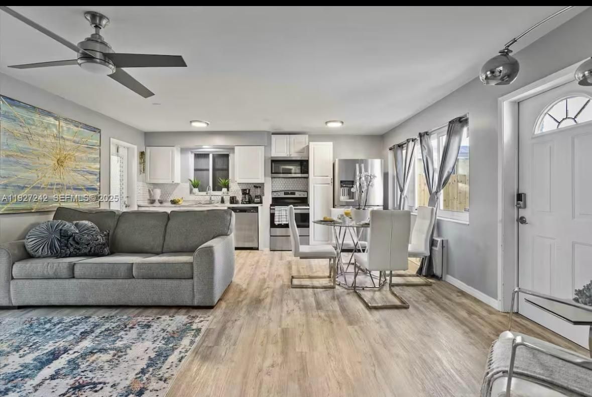Dining room, Interior, Kitchen, Living room, Recessed Lighting, Stainless Steel Appliances, Wood Texture Flooring