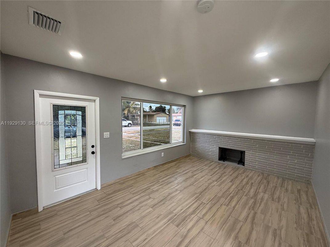 Empty room, Fireplace, Interior, Recessed Lighting, Wood Texture Flooring