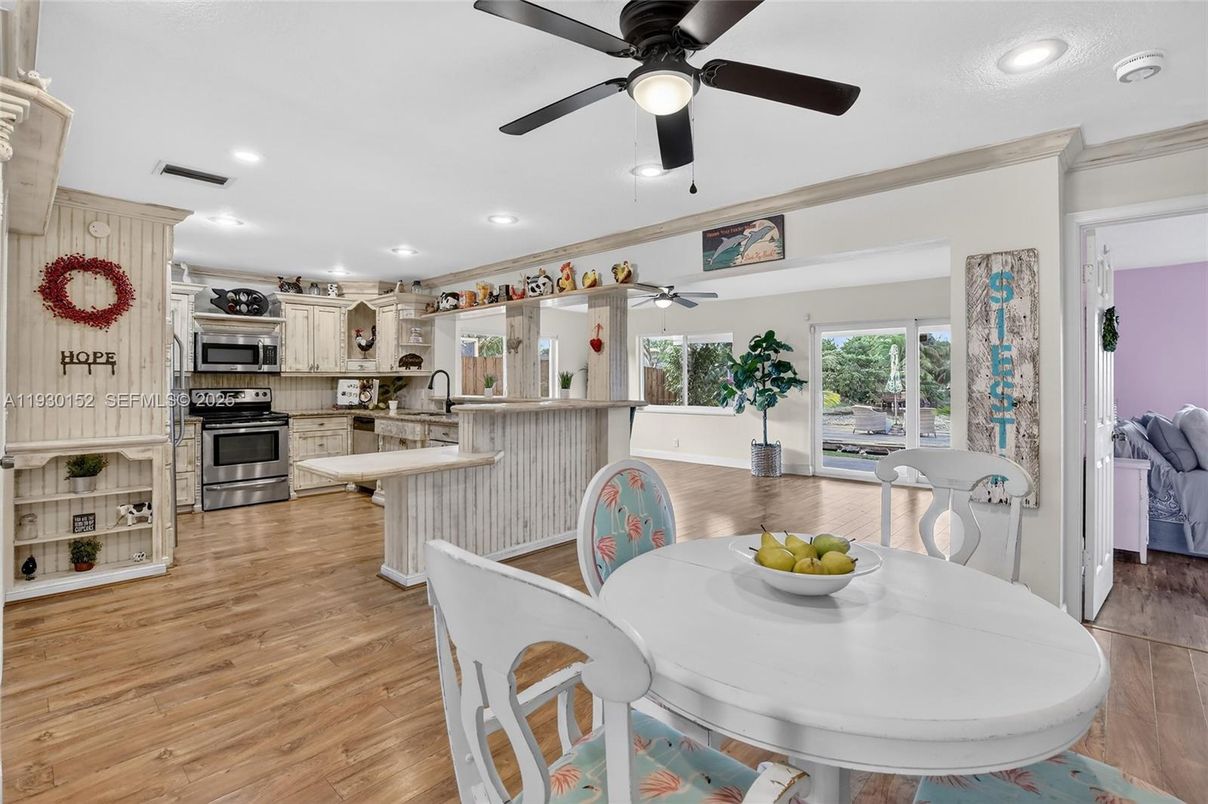 Dining room, Interior, Kitchen, Recessed Lighting, Stainless Steel Appliances, Wood Texture Flooring