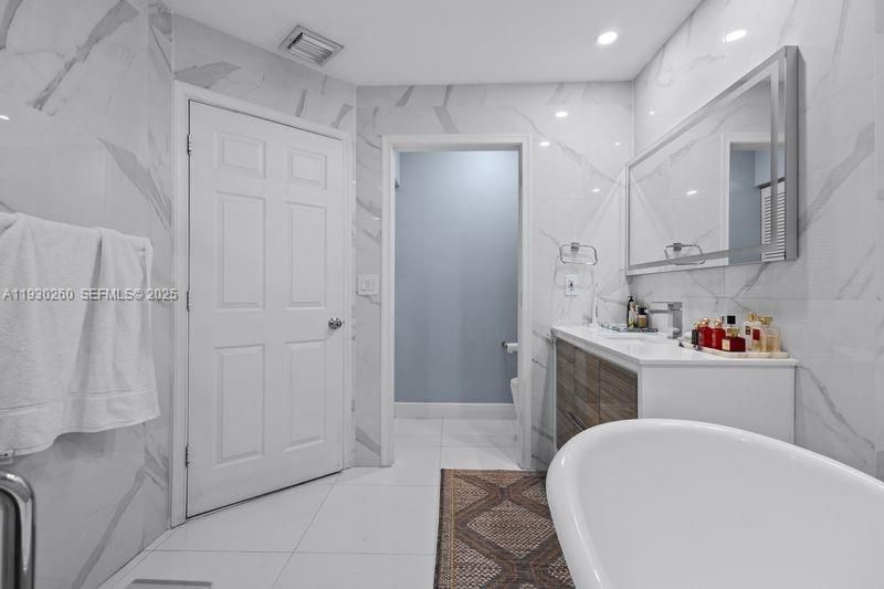 Bathroom, Free Standing Baths, Glass Shower, Interior, Marble Walls, Recessed Lighting