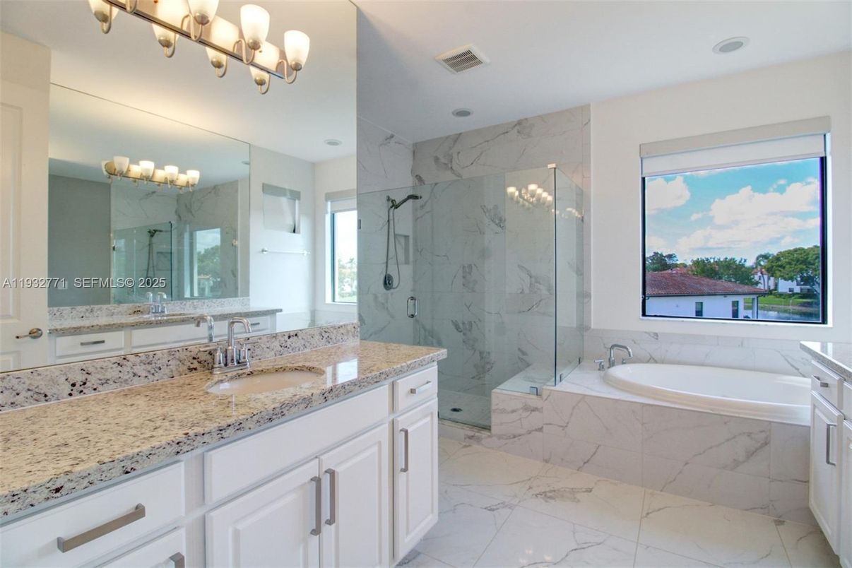 Bathroom, Dual Sink Vanities, Glass Shower, Interior, Marble, Marble Walls, Recessed Lighting