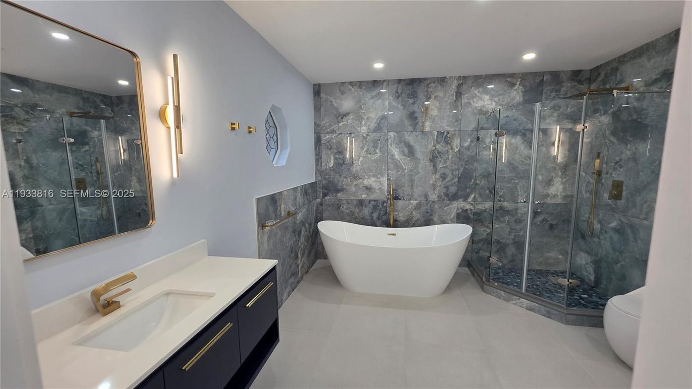 Bathroom, Dual Sink Vanities, Free Standing Baths, Glass Shower, Interior, Marble Walls, Recessed Lighting