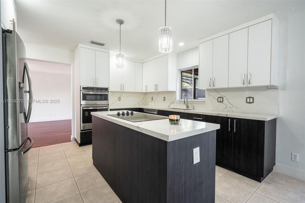 Interior, Kitchen, Marble Walls, Pendant Lights, Recessed Lighting, Stainless Steel Appliances