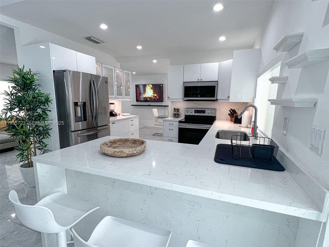 Fireplace, Interior, Kitchen, Living room, Marble, Recessed Lighting, Stainless Steel Appliances