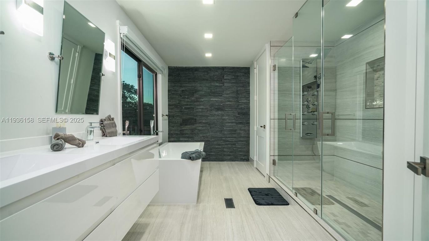 Bathroom, Dual Sink Vanities, Free Standing Baths, Glass Shower, Interior, Recessed Lighting, Wood Texture Flooring