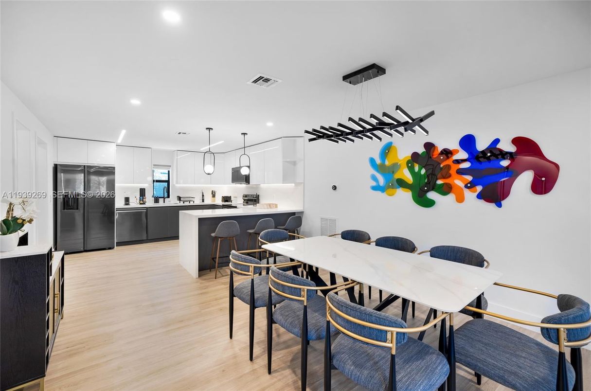 Dining room, Interior, Kitchen, Pendant Lights, Recessed Lighting, Stainless Steel Appliances, Wood Texture Flooring