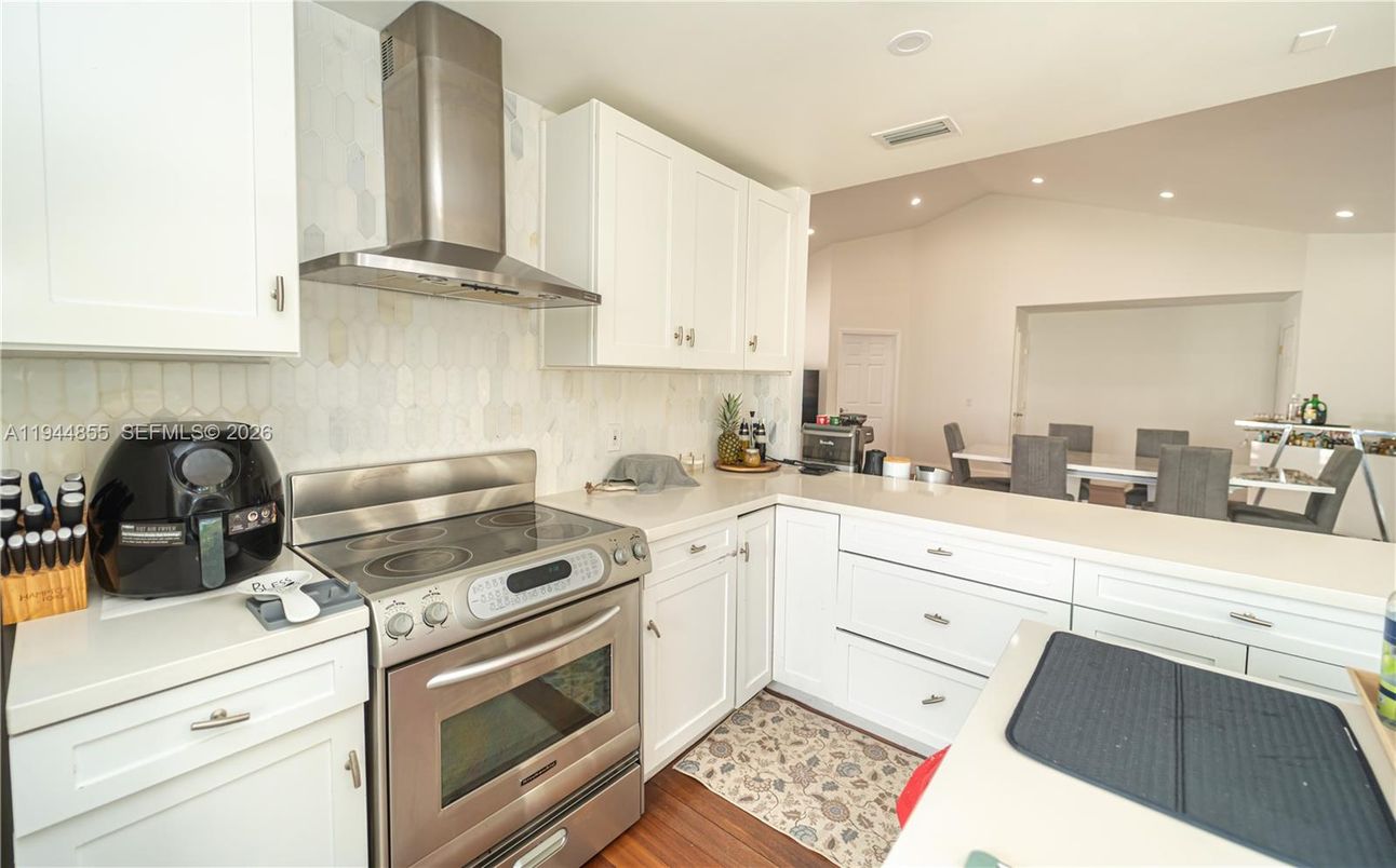 Dining room, Interior, Kitchen, Recessed Lighting, Stainless Steel Appliances, Wood Texture Flooring