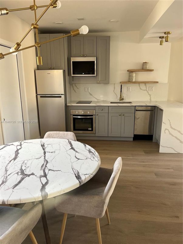 Dining room, Interior, Kitchen, Pendant Lights, Stainless Steel Appliances, Wood Texture Flooring